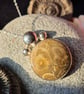 Handmade sterling silver and fossilised coral pendant