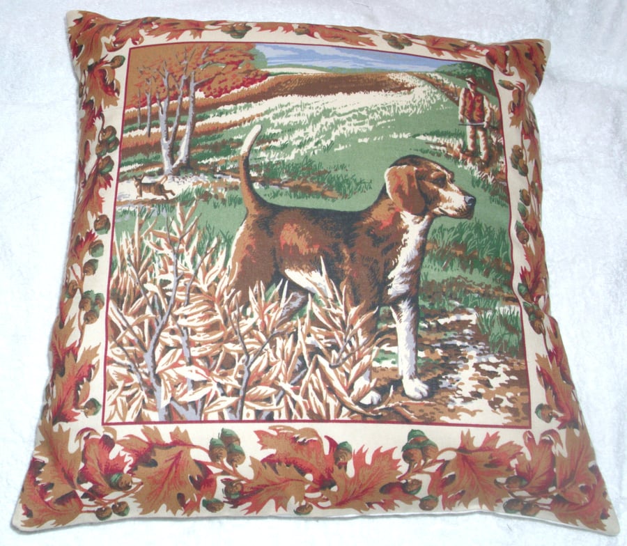 A Beagle waiting patiently in a field cushion