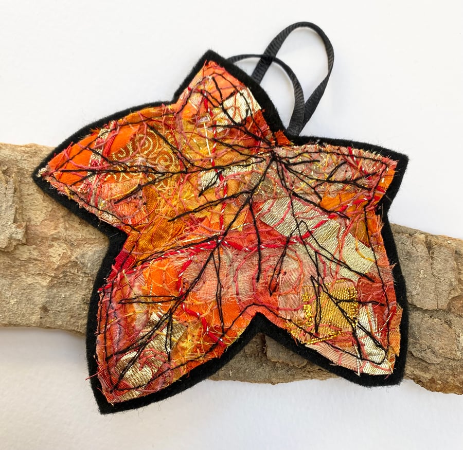 Embroidered up-cycled leaf home decoration.