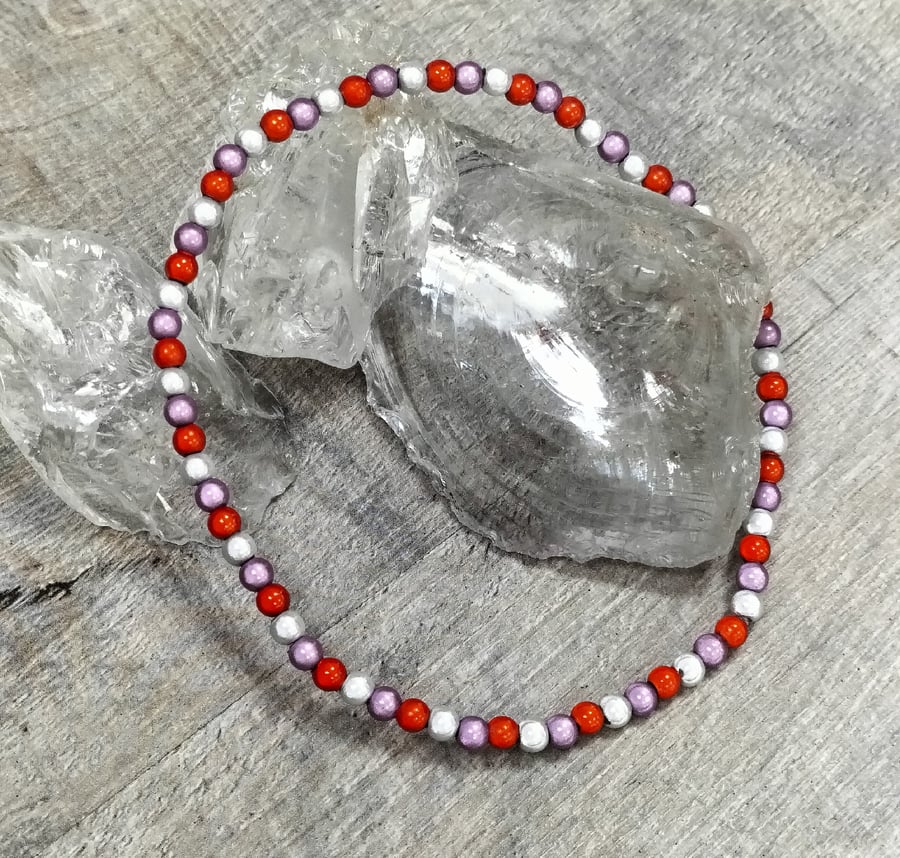 AL105 Orange, mauve and silver elasticated miracle bead anklet