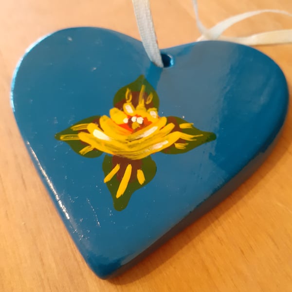 Bright blue ceramic hanging heart with canal art style roses 