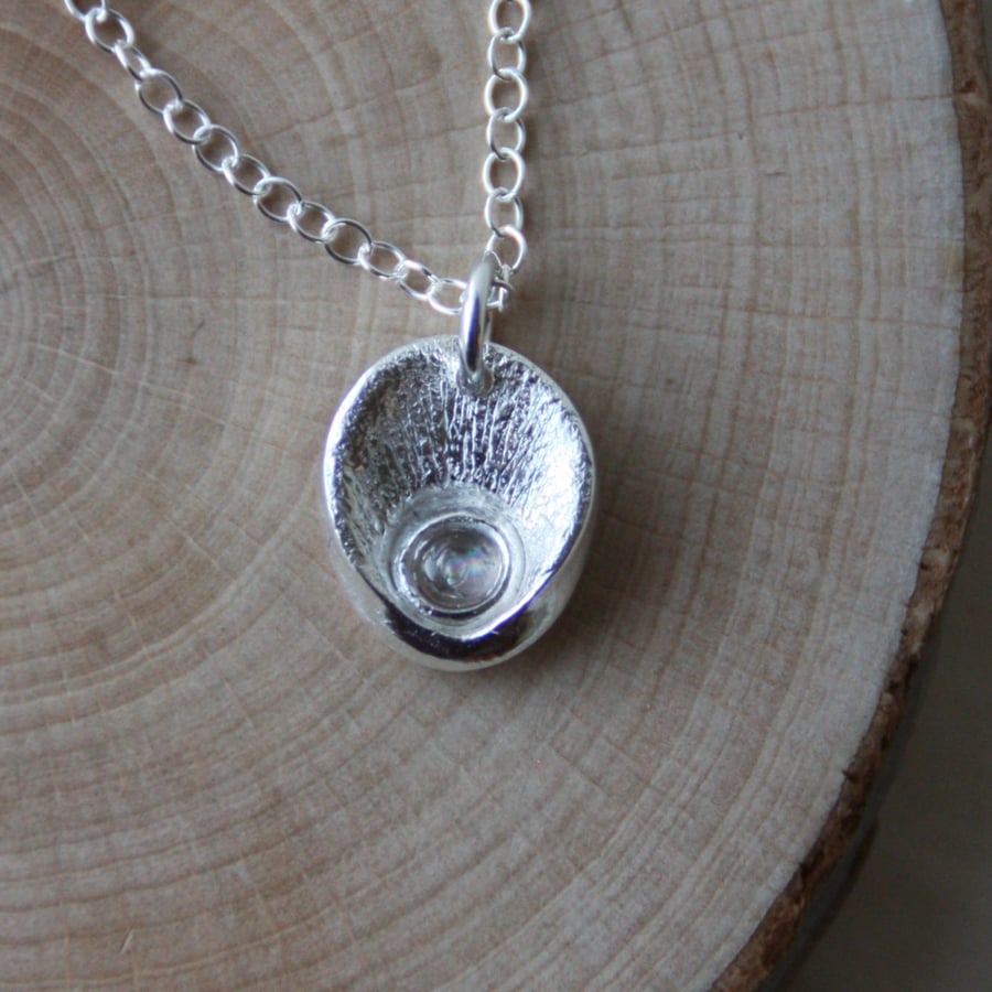  Fine silver 'oyster shell' pendant necklace with moonstone detail 