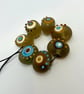 Handmade brown, ivory and turquoise patterned lamp work glass beads - Image 4