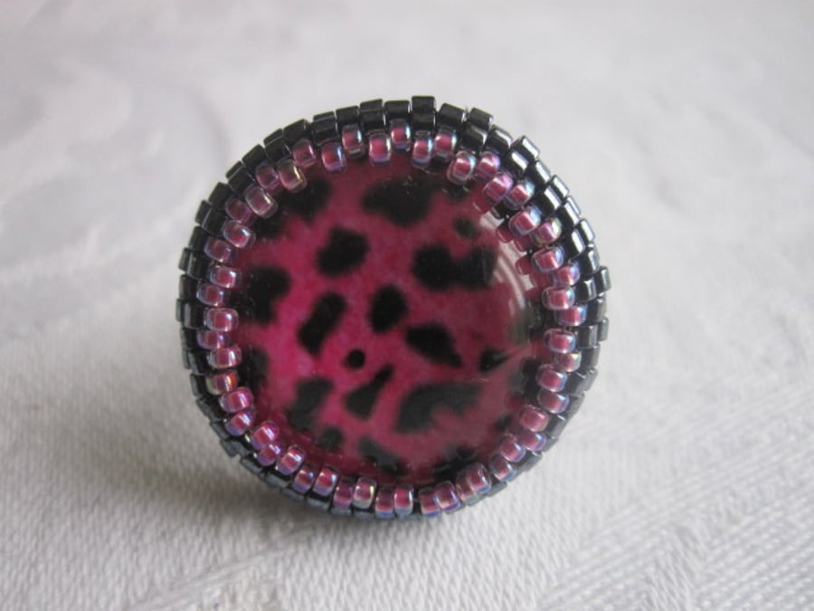 A Pink and Black Animal Print Ring