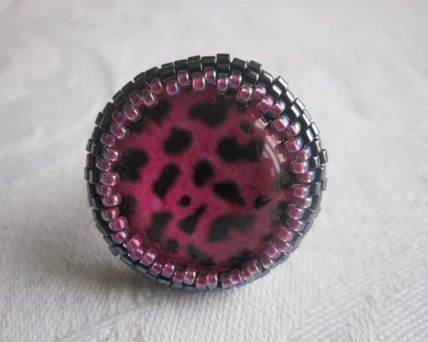 A Pink and Black Animal Print Ring