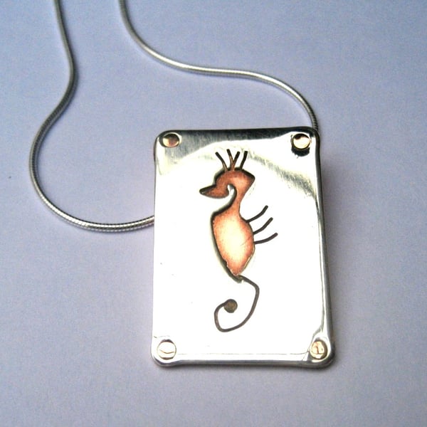 Seahorse pendant in sterling silver and copper