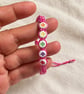 Children's Pink Macramé Bracelet with Colourful Flower Beads – Adjustable - Image 4