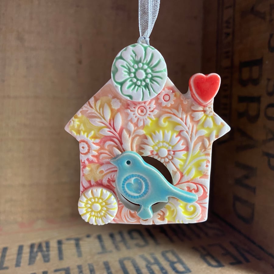 Small Ceramic bird house decoration with green flower
