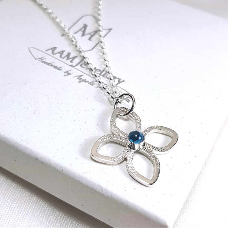 Silver and Blue Topaz Flower Pendant Necklace