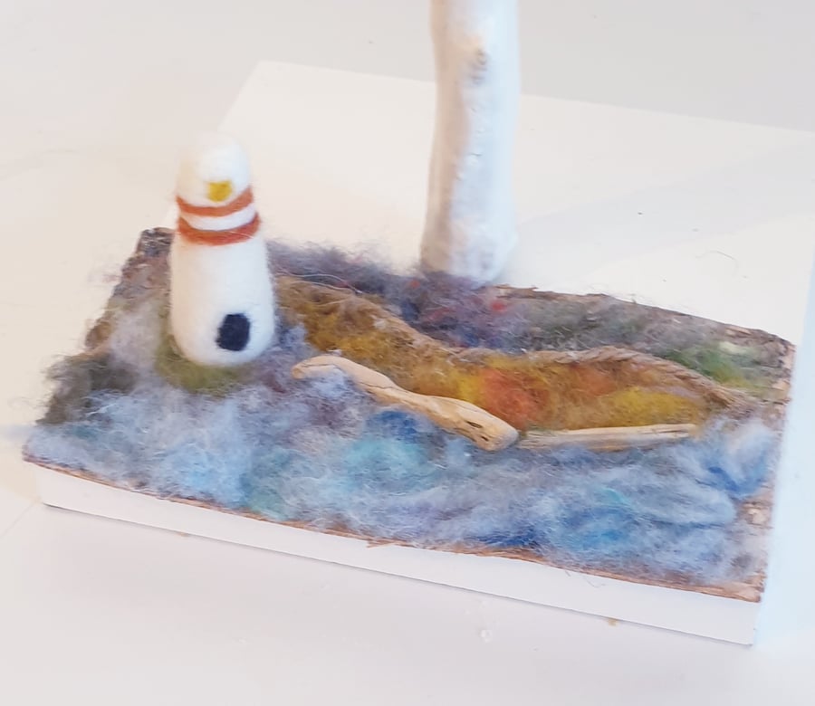 Handcrafted Needle Felted Sculpture Ornament Of A Lighthouse On a Slice Of Bark