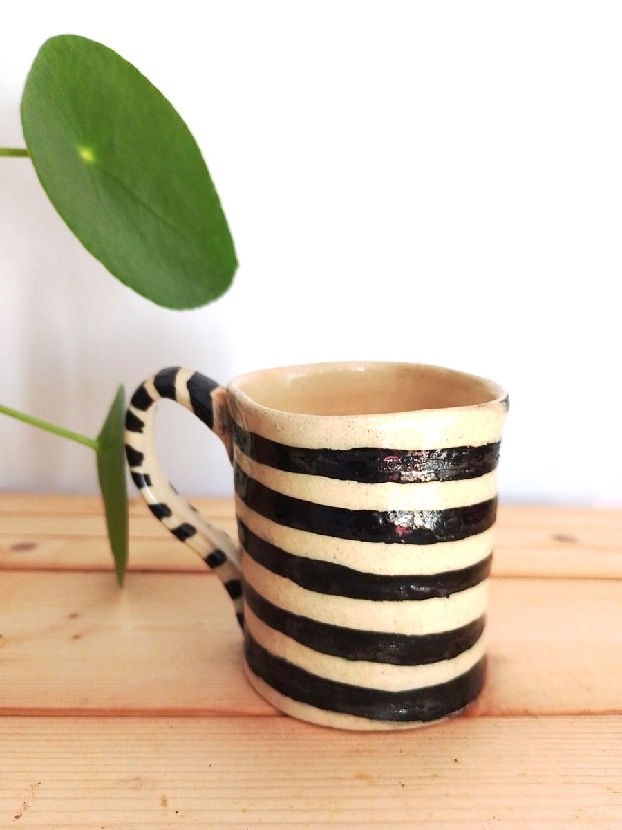 wonky stripey black and white ceramic mug, curiosity novelty pottery mug