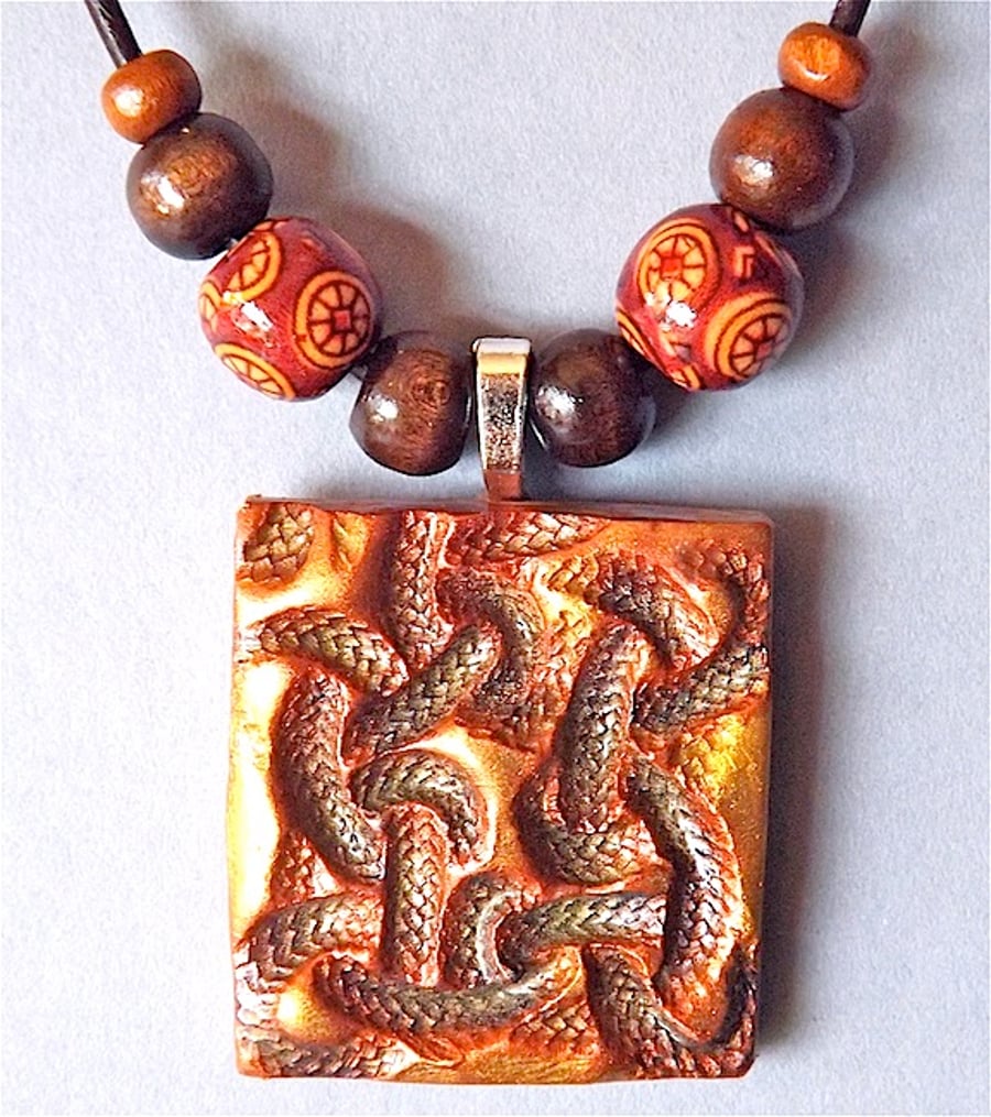 Celtic knot pendant, talisman, necklace, polymer clay and wood beads.