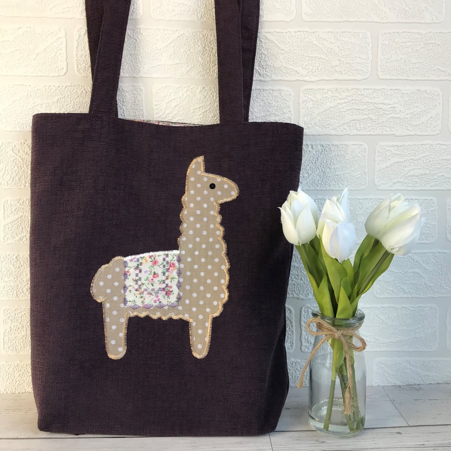 Llama tote bag in dark plum purple with beige polka dot llama and floral blanket