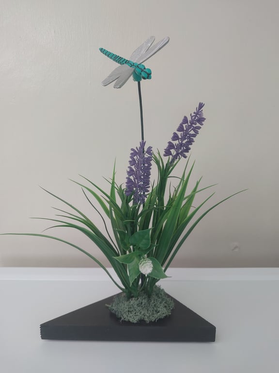 Dragonfly flower arrangement display on wood plinth