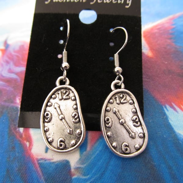 Quirky Salvador Dali inspired surrealist melted clock earrings.