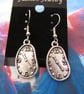 Quirky Salvador Dali inspired surrealist melted clock earrings.