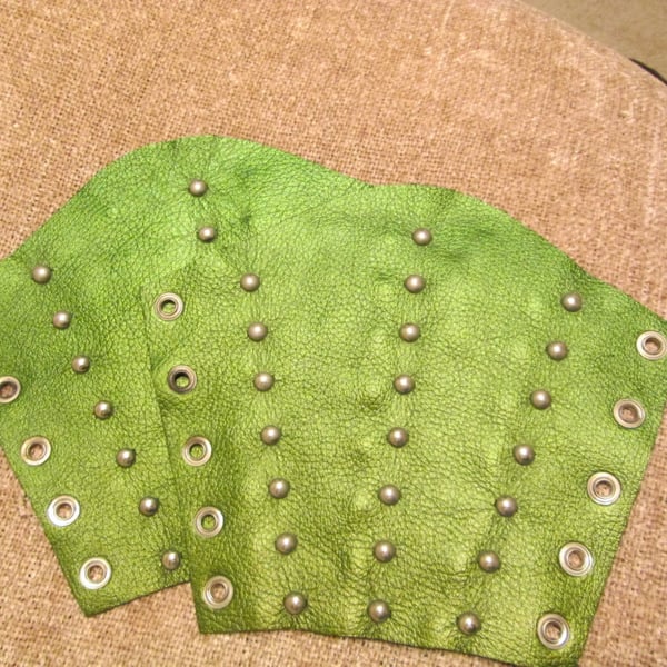 Large Pair of metallic green leather bracers with 3 rows of nickel plated spots