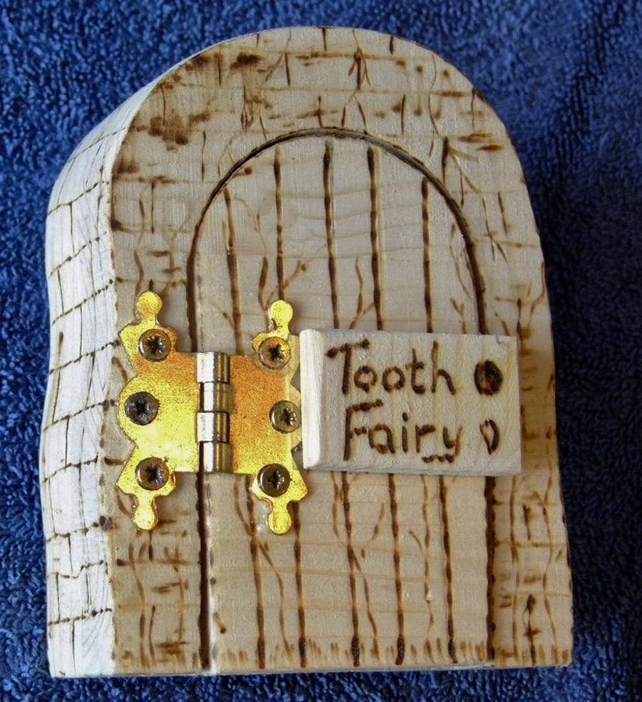 Handcrafted wooden magical Tooth Fairy or hobbit door for a child's lost tooth.