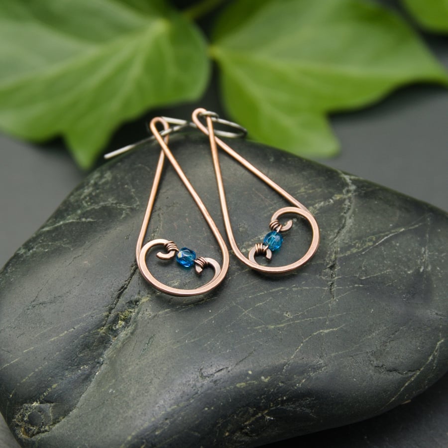 Hammered Copper Teardrop Swirl Earrings with Capri Blue Faceted Glass Beads