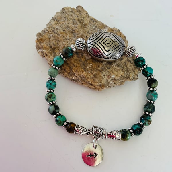 December Sagittarius birthday charm bracelet featuring turquoise beads