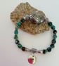 December Sagittarius birthday charm bracelet featuring turquoise beads