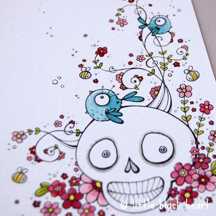 smiling skull, bluebirds and blossom