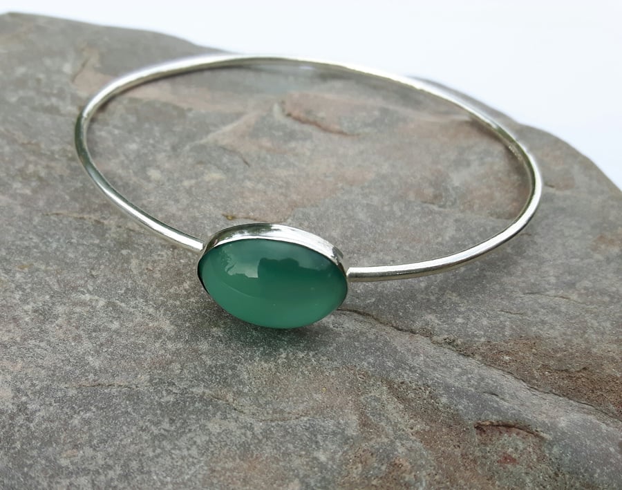 Silver bangle with turquoise cat's eye cabochon