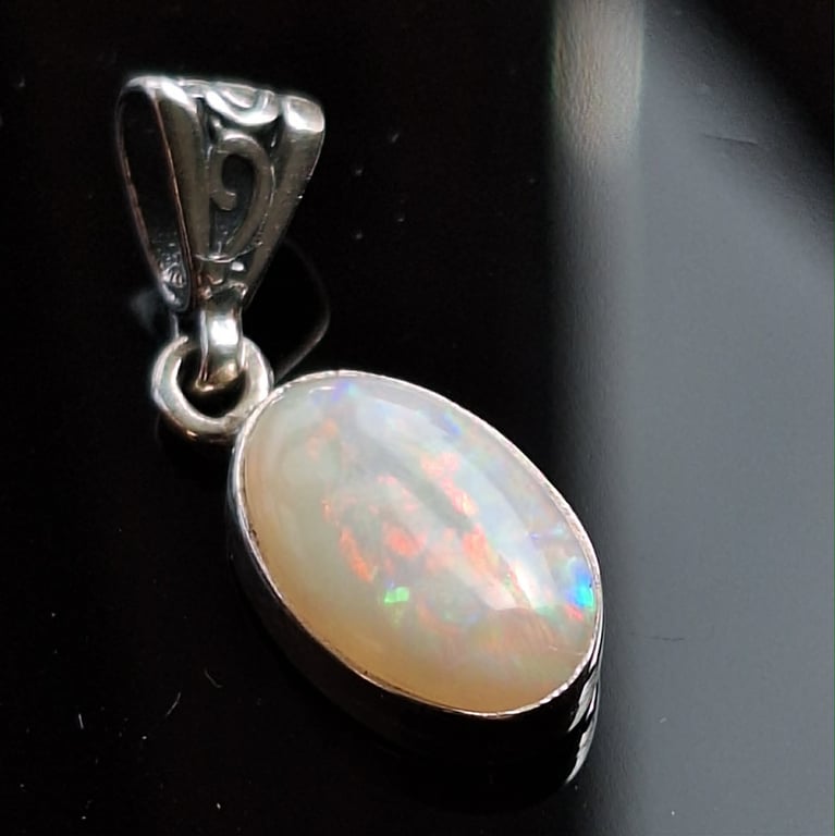 9x15mm 2.5 ct free form CP Olympic opal set in 925 sterling silver