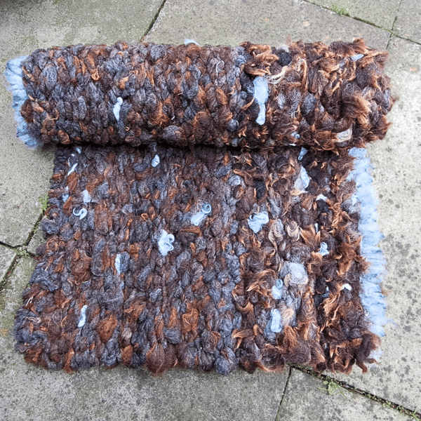 Pure British sheep wool rug with assimetrical blue fringe