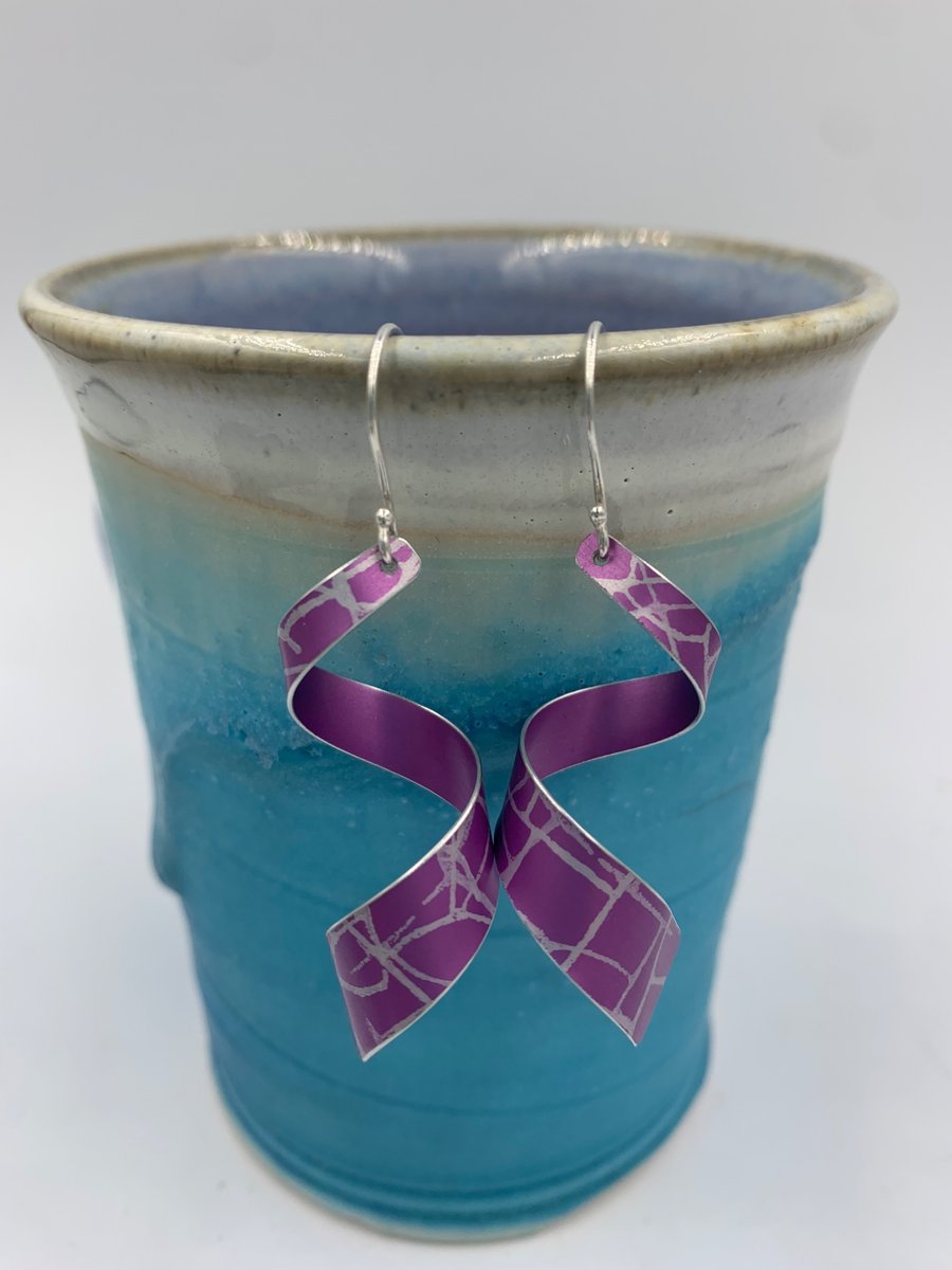 Pink patterned aluminium spiral dangly earrings 