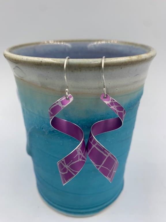 Pink patterned aluminium spiral dangly earrings 