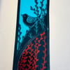 stained glass panel of a bird on a branch 