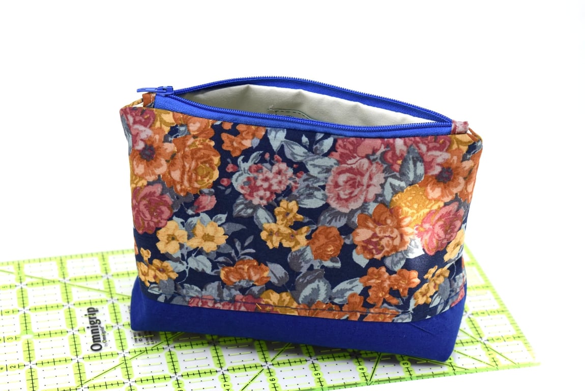 A beautiful blue flowery fabric pouch storage, for home or away.