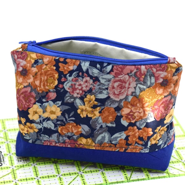 A beautiful blue flowery fabric pouch storage, for home or away.