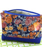 A beautiful blue flowery fabric pouch storage, for home or away.