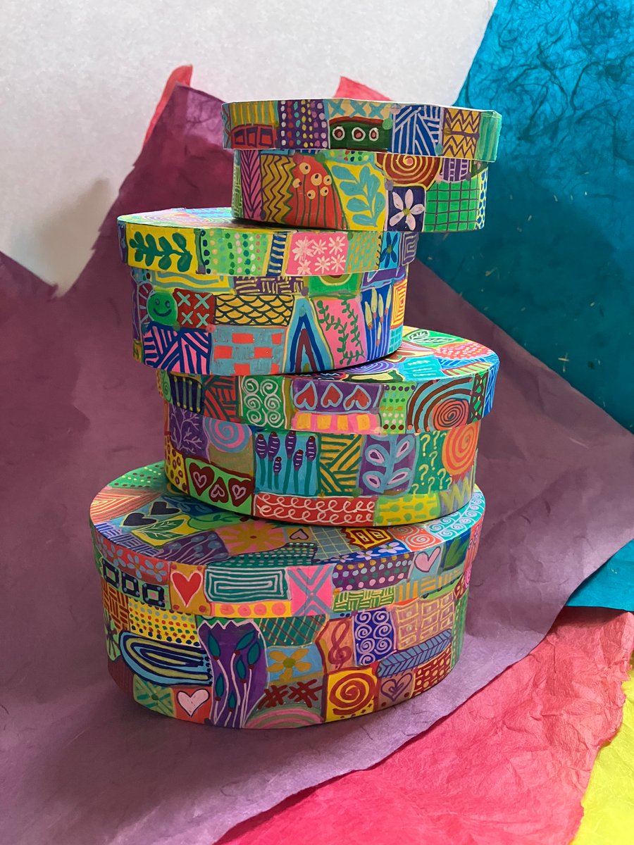 Set of 4 oval, hand painted gift boxes