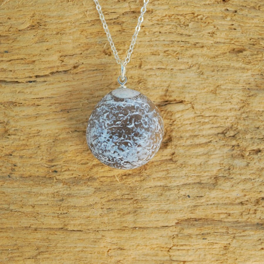 Shiny flint pebble pendant