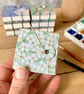Coptic Bound Tiny Floral Watercolour Sketchbook. Pale Green, white and yellow.