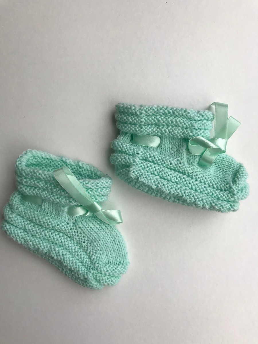 Hand knitted baby bootees
