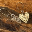 Silver heart dangling drop earrings 