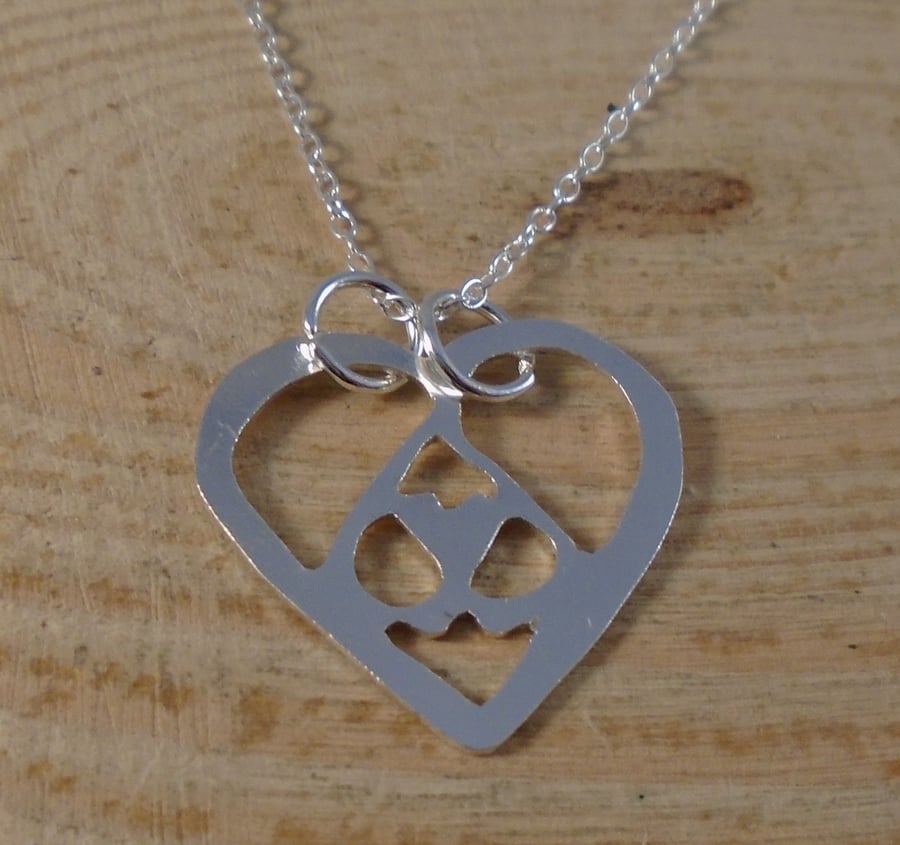 Sterling Silver Pierced Hearts Necklace