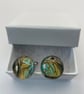 Pair of cuff links with gold, turquoise and black pigments 