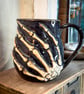 Grasping Skeleton Hand Mug