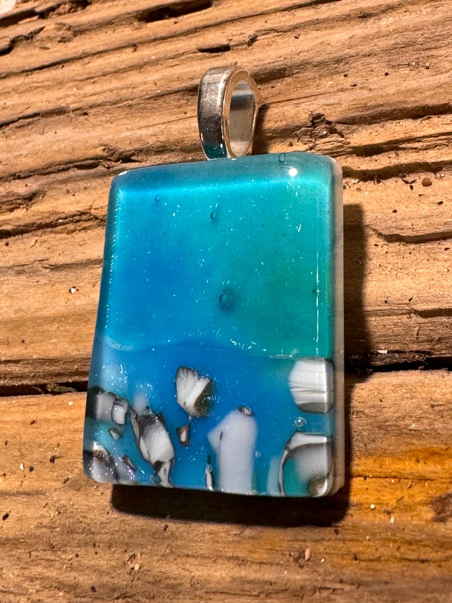 Iridescent ocean inspired handmade glass pendant 