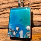 Iridescent ocean inspired handmade glass pendant 
