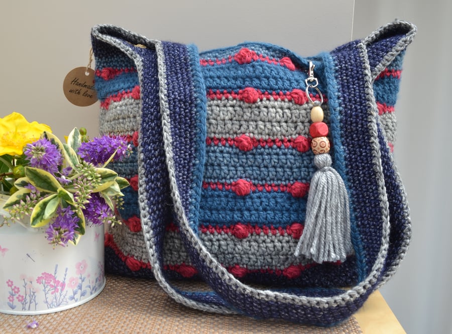 Delightful Blue & Grey Bag With Red Bobbles
