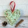 Pale sage green Christmas hanging heart decoration with holly and mistletoe