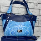 Handbag in blue faux leather with crossbody strap