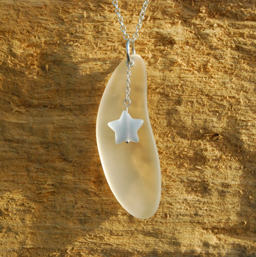 Beach glass pendant with moon and star