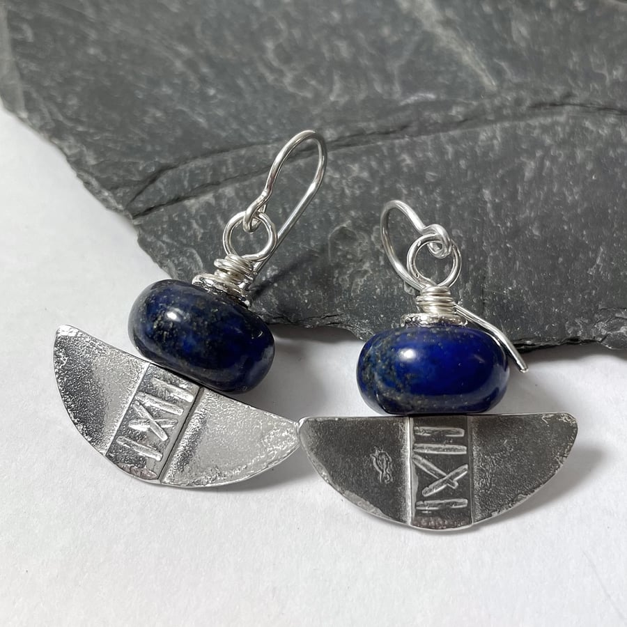 Silver and lapis lazuli tribal blade earrings.